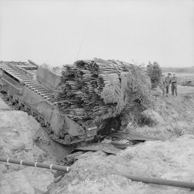 Churchill AVRE of 163rd Brigade, 54th Division, with fascine during ditch crossing exercises near Dunwich, 14 April 1943.