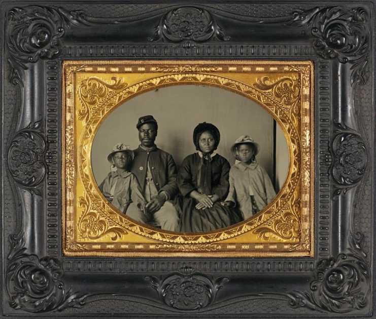 Sgt. Samuel Smith of the 119th USCT in uniform with family.