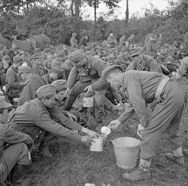 Tea is served to German prisoners in the Falaise pocket, 22 August 1944.