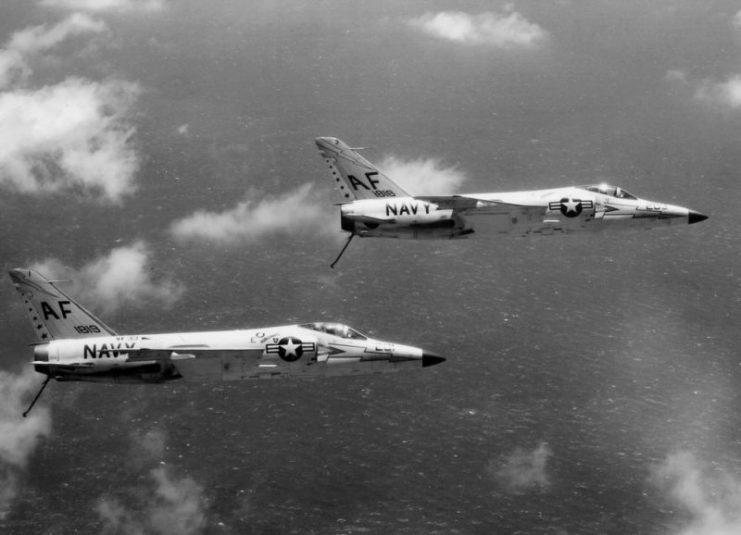 Two U.S. Navy Grumman F11F-1 Tiger fighters (BuNos 141818, 141819) of Fighter Squadron VF-33 “Astronauts” in flight in 1960. VF-33 was assigned to Carrier Air Group 6 (CVG-6) (tail code “AF”) aboard the aircraft carrier USS Intrepid (CVA-11).