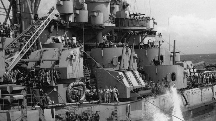 5 inch turrets aboard USS Massachusetts (BB-59). Taken during refueling from the T3-S2-A1 class Kaskaskia (AO-27) during a storm at sea, 17 October 1944.