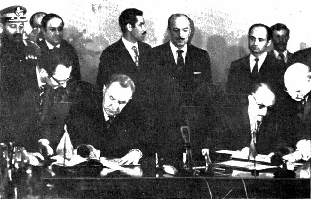 Alexei Kosygin (left) and Ahmed Hassan al-Bakr signing the Iraqi–Soviet Treaty of Friendship and Co-Operation in 1972