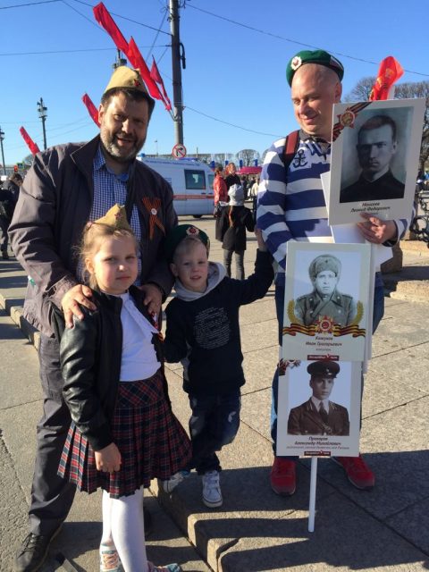 Families Celebrate Victory Day with Portraits of Their Ancestors that Fought in the Great Patriotic War and St. George’s Ribbon.