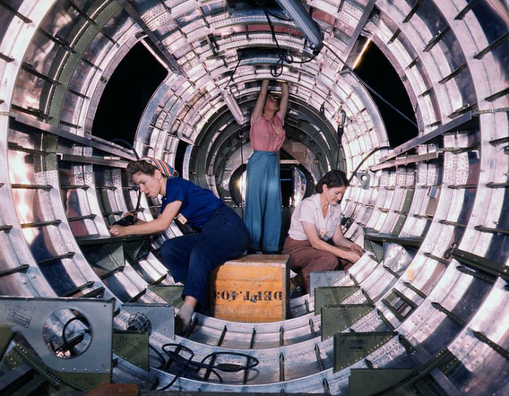 Women workers install fixtures and assemblies to a tail fuselage section of a B-17 bomber at the Douglas Aircraft Company plant, Long Beach, California
