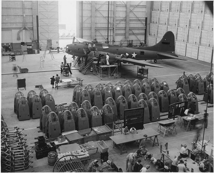 A completed B-17 F heavy bomber is checked by final inspectors at the Long Beach, California., plant of Douglas Aircraft.