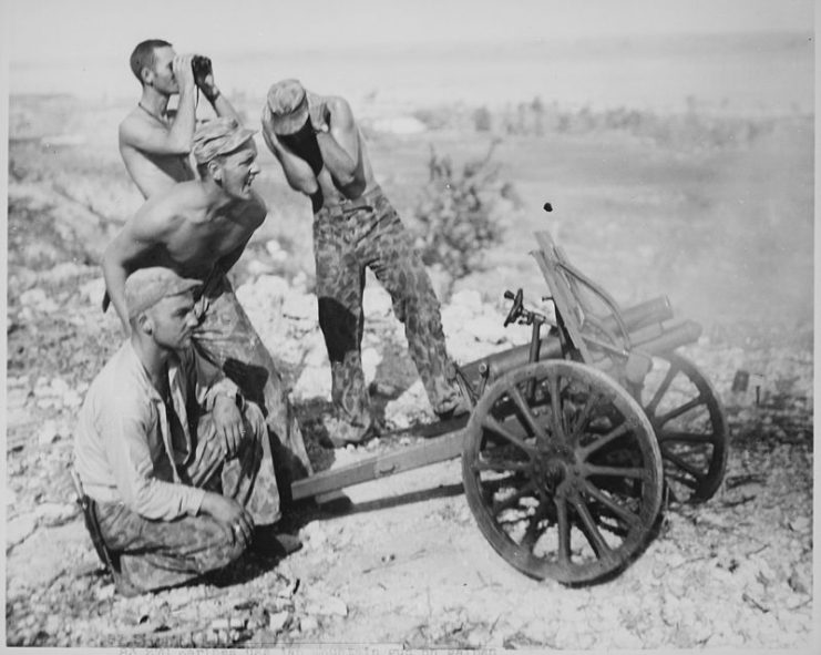 Marines fire captured mountain gun during the attack on Garapan,
