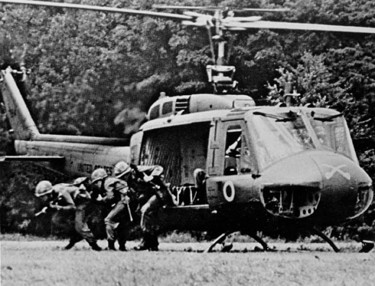 A U.S. Army rifle squad from the Blue Team of the 1st Squadron, 9th Cavalry exiting from a Bell UH-1D Huey helicopter in Vietnam.It was the air cavalry reconnaissance squadron of the 1st Cavalry Division throughout the division’s service in Vietnam from 1965 to 1972.