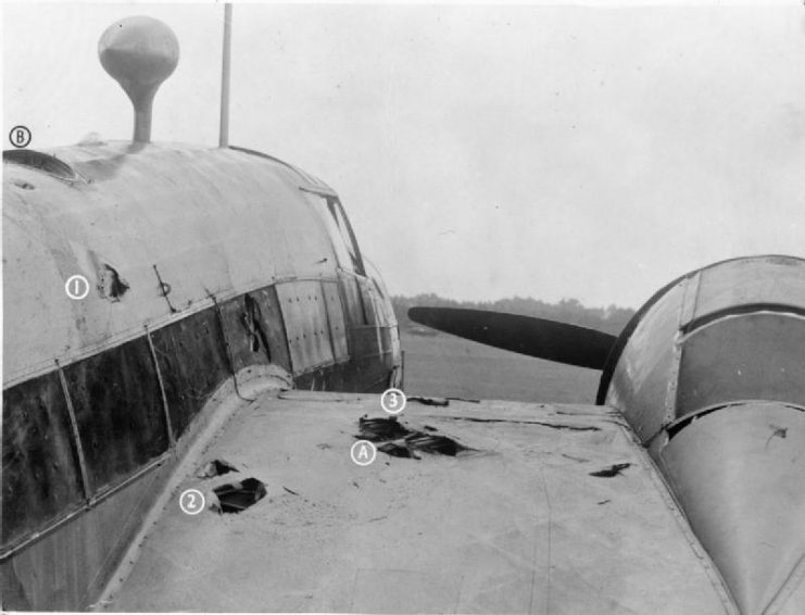 While over the Zuider Zee, cannon shells from an attacking Messerschmitt Me 110 struck the starboard wing (A), causing a fire from a fractured fuel line which threatened to to spread to the whole wing. Efforts by the crew to douse the flames failed, and Sergeant James Allen Ward, the second pilot, volunteered to tackle the fire by climbing out onto the wing via the astro-hatch (B). With a dinghy-rope tied around his waist, he made hand and foot-holds in the fuselage and wings (1, 2 and 3) and moved out across the wing from where he was eventually able to extinguish the burning wing-fabric.