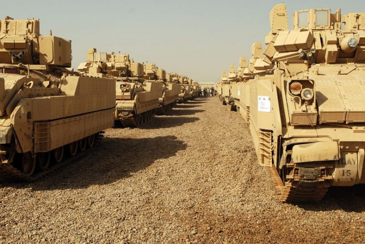 Ammunition carriers stand ready at the Four Corners staging area at Camp Taji, awaiting final inspection before they are transported to Kuwait for eventual shipment back to the United States, 2009