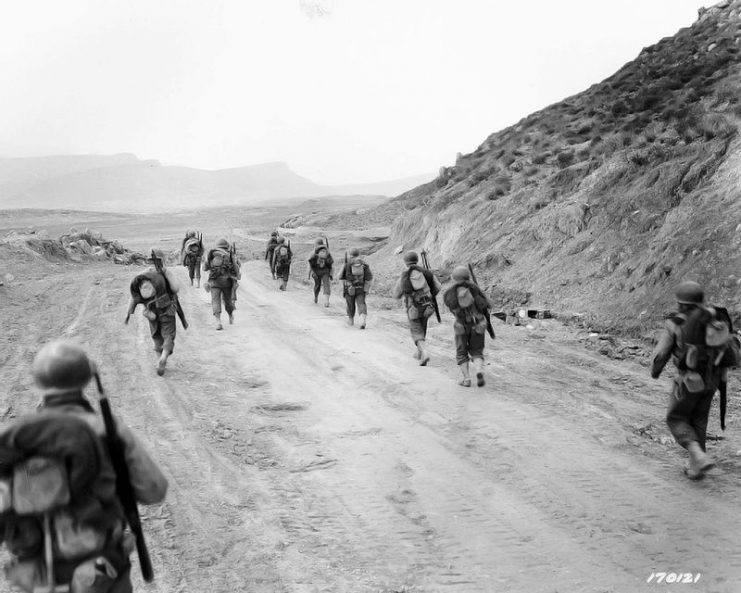 American troops moving through the Kasserine Pass