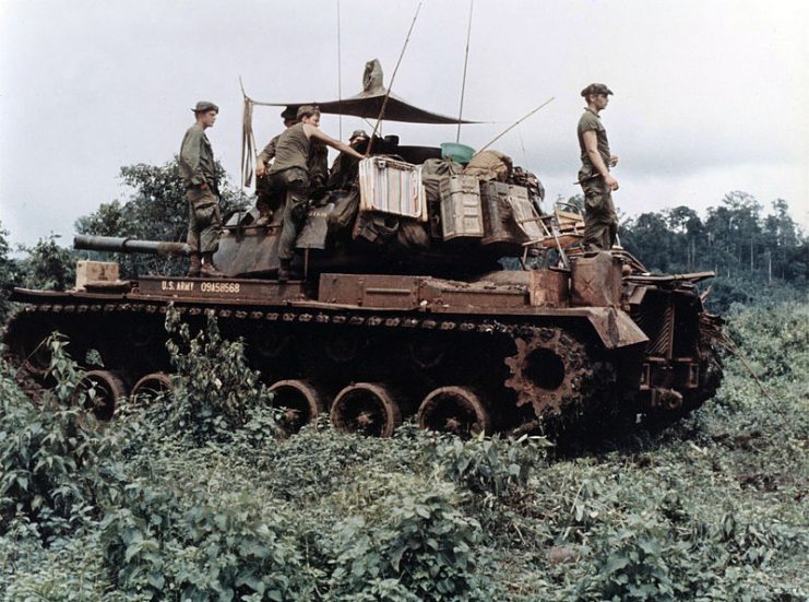 M48 Patton tank move through the dense jungle in the Central Highlands of Vietnam