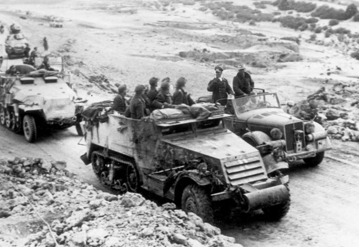 Rommel in Tunisia speaking with troops riding a captured American built M3 Half-track.Photo: Bundesarchiv, Bild 146-1990-071-31 : CC-BY-SA 3.0