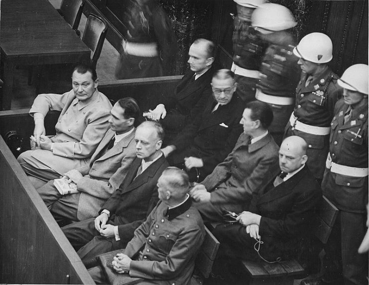 Nuremberg Trials. Defendants in their dock, circa 1945-1946. (in front row, from left to right): Hermann Göring, Rudolf Heß, Joachim von Ribbentrop, Wilhelm Keitel (in second row, from left to right): Karl Dönitz, Erich Raeder, Baldur von Schirach, Fritz Sauckel