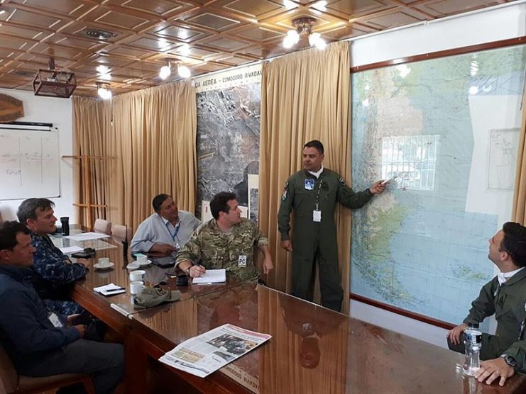Argentine and British military personnel during a briefing about the status of ARA San Juan