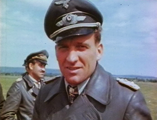 Hans-Ulrich Rudel after his capture. In the background – Adolf Galland