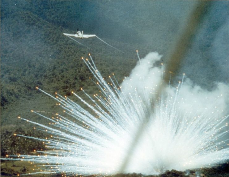 U.S. Air Force Douglas A-1E Skyraider drops a white phosphorus bomb on a Việt Cộng position in South Vietnam in 1966.