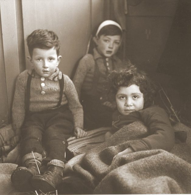 Three Jewish children rescued from Theresienstadt resting in the Hadwigschulhaus in St. Gallen.