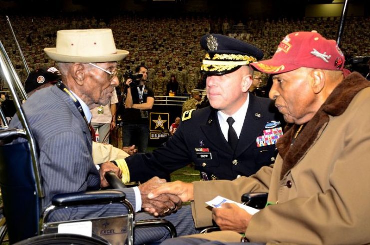 Richard Overton (left), America’s oldest veteran at 109 years old, greets Dr. Granville Coggs (right), a Tuskegee Airmen, and Maj. Gen. Jeffery Snow (center), commanding general of U.S. Army Recruiting Command, during the pre-game ceremonies of the 2016 U.S. Army All-American Bowl, Jan. 9.