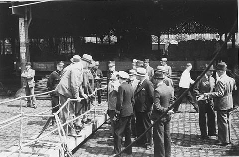 St. Louis Captain Gustav Schröder negotiates landing permits for the passengers with Belgian officials in the Port of Antwerp.
