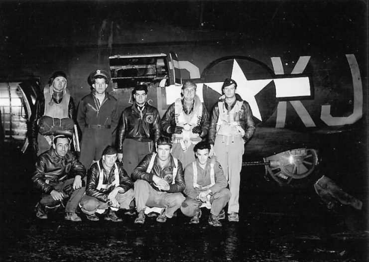 USAAF Crew poses at night time by their B-17 Bomber.