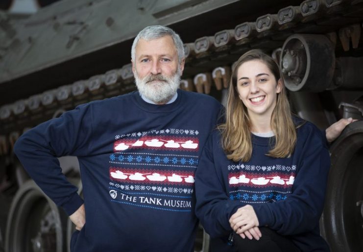 The Tank Museum curator David Willey and film intern Chloe Shipley wearing the new Christmas jumpers.
