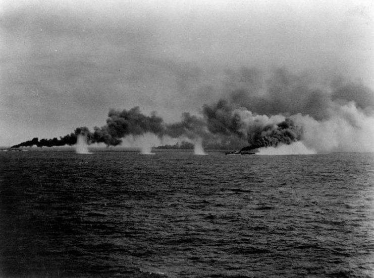 Destroyers of Taffy 3 making smoke under fire.