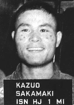 Kazuo Sakamaki, burned his cheeks with a cigarette before posing for this booking photograph.