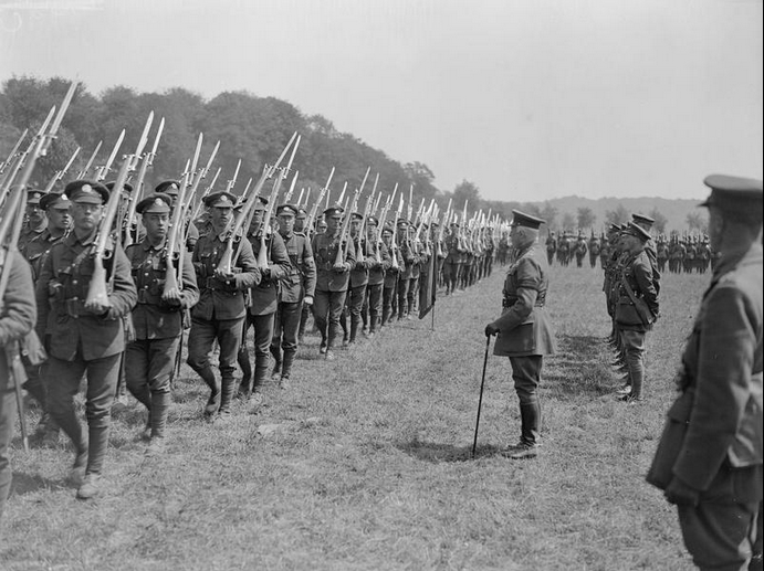 Troops of the 1st Battalion, Northamptonshire Regiment marching past Prince Arthur, the Duke of Connaught, at his inspection of the 2nd Brigade, near Bruay, 1 July 1918.