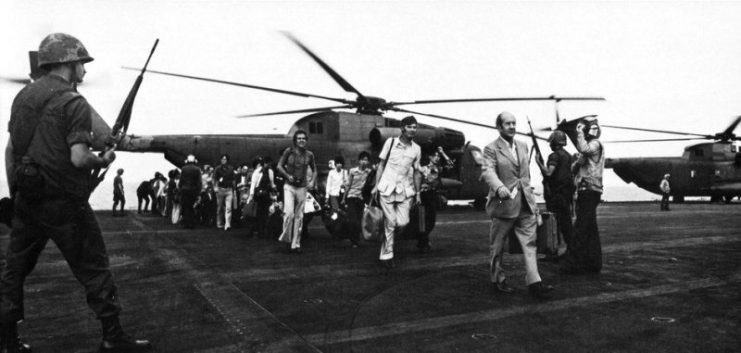 Evacuees from Vietnam aboard the flight deck of the aircraft carrier USS Midway (CVA-41) during “Operation Frequent Wind”