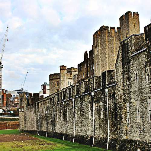 The Tower of London and its now dry moat which will be filled with almost 900,000 red ceramic poppies for the commemoration of the WWI Centenary.