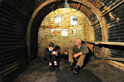 Harvey Cotton, the boy who discovered the air raid shelter, along with the school's caretaker, Chris Poulter.
