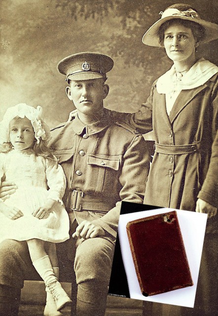 Private Wilfrid Bush and the Bible that saved him (inserted photo).