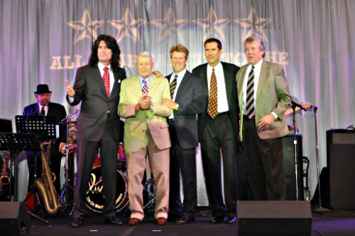 KISS guitarist Tommy Thayer (left, in black suit) with his father, WWII hero Brig. Gen. James B. Thayer (standing right next to him).