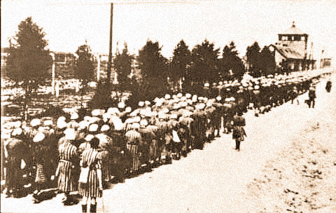 The women inmates of Ravensbruck lined up after a day of working in forced labor.
