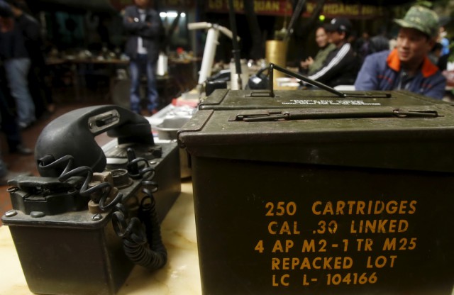 A two-way radio set and a cartridge box of the U.S. military which were used during the Vietnam War are displayed for sale at an old items market in Hanoi