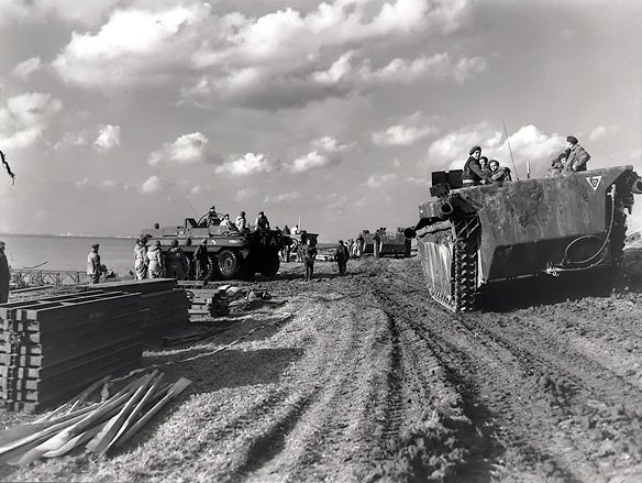 Alligator_amphibious_vehicles_passing_Terrepin_amphibious_vehicles_(to_the_left)_during_the_Battle_of_the_Scheldt_-_October_13,_1944