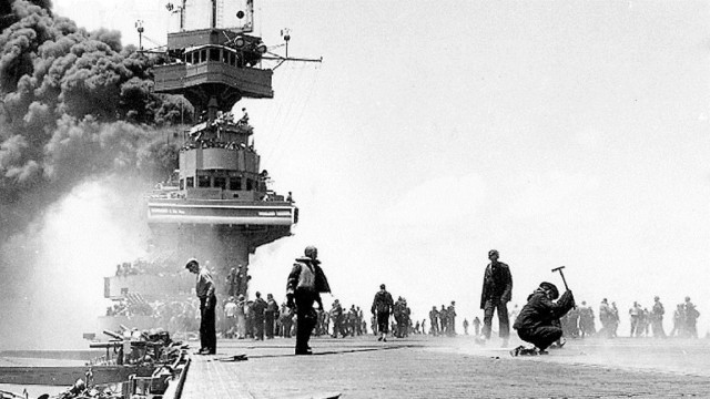 The USS Yorktown on fire Courtesy of the Naval History and Heritage Command This famous image taken during the Battle of Midway by Bill Roy shows the flight deck of the aircraft carrier USS Yorktown (CV-5) shortly after it was hit by three Japanese bombs on June 4, 1942.
