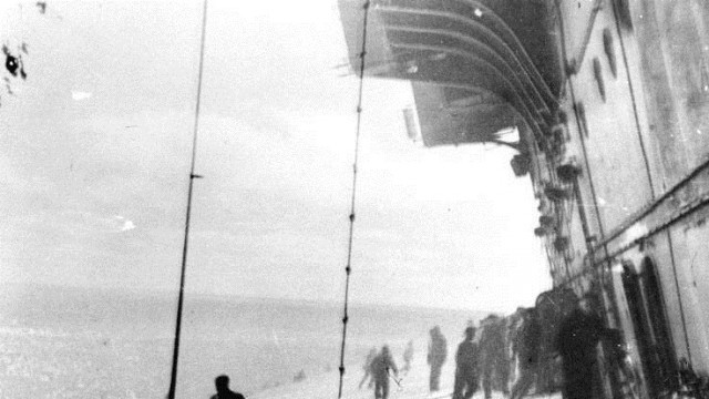 Preparing to abandon ship Courtesy of the Naval History and Heritage Command The crew of the mortally wounded USS Yorktown leans against the list of the sinking ship as they prepare to evacuate during the Battle of Midway.