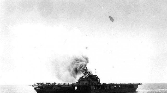 Following a bomb attack Courtesy of the Naval History and Heritage Command The USS Yorktown is shown burning from a Japanese bombing attack shortly after noon on 4 June 1942 during the Battle of Midway.