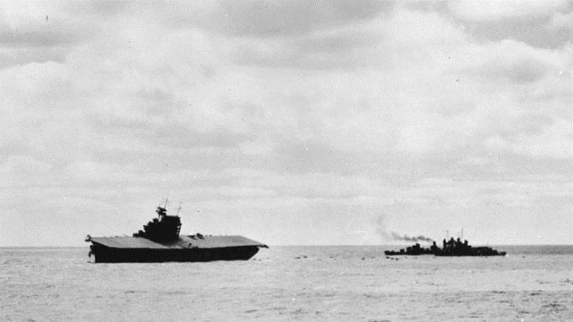 Life rafts in the water Courtesy of the Naval History and Heritage Command Life rafts dot the water between the sinking USS Yorktown and a waiting destroyer as the carrier's crew abandons ship during the Battle of Midway.