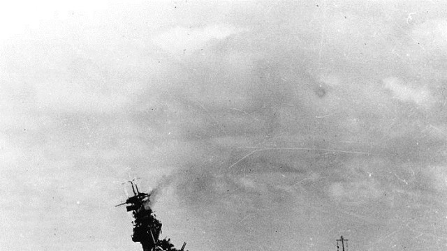 Listing badly Courtesy of the Naval History and Heritage Command The USS Yorktown lists after multiple Japanese attacks during the Battle of Midway, forcing the crew to escape to a waiting destroyer.