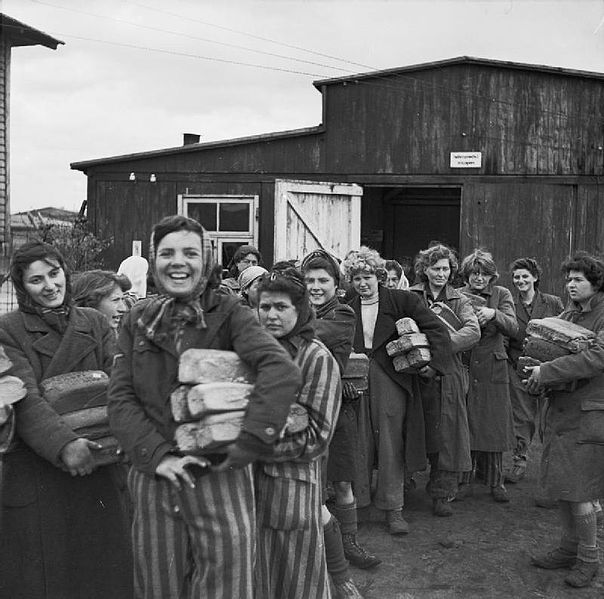 Female inmates at Bergen-Belsen after liberation in April 1945. They’re collecting extra bread rations provided by the Allies