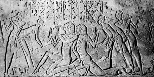 Carving that depicts the torturing of the Hittite scouts/spies for information.