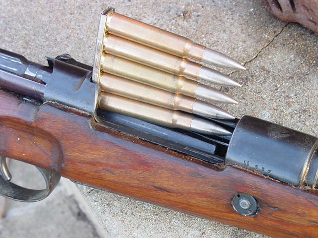 Karabiner 98k stripper clip with five 7.92×57mm Mauser cartridges