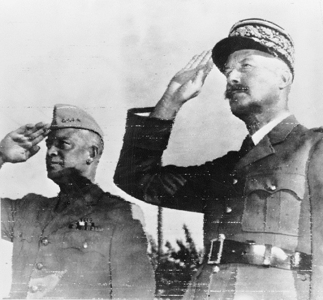 Algiers, French Algeria. General Dwight D. Eisenhower, commander in chief of the Allied Armies in North Africa, and General Henri Honoré Giraud, commanding the French Forces, saluting the flags of both nations at Allied headquarters. (Wikipedia)
