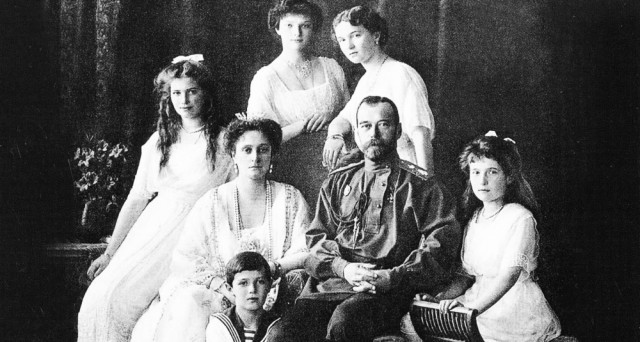 Czar Nicolas, Alexandra, their four daughters, and Alexei kneeling before his mother