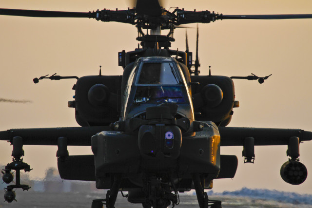 A U.S. Army AH-64 Apache attack helicopter prepares to depart Bagram Air Field, Afghanistan, Jan. 7, 2012. The Apache conducts distributed operations, precision strikes against relocatable targets, and provides armed reconnaissance when required in day, night, obscured battlefield and adverse weather conditions.
