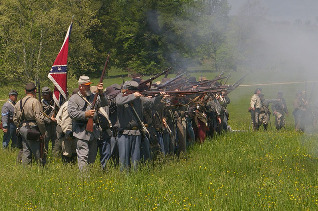 American Civil war Reenactors fire a volley (Photo by MamaGeek, Wikipedia)