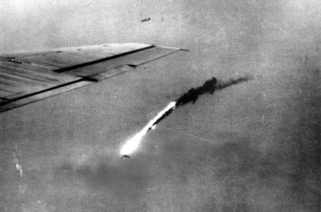 With one wing gone, a B-29 falls in flames after a direct hit by enemy flak over Japan. (U.S. Air Force photo)