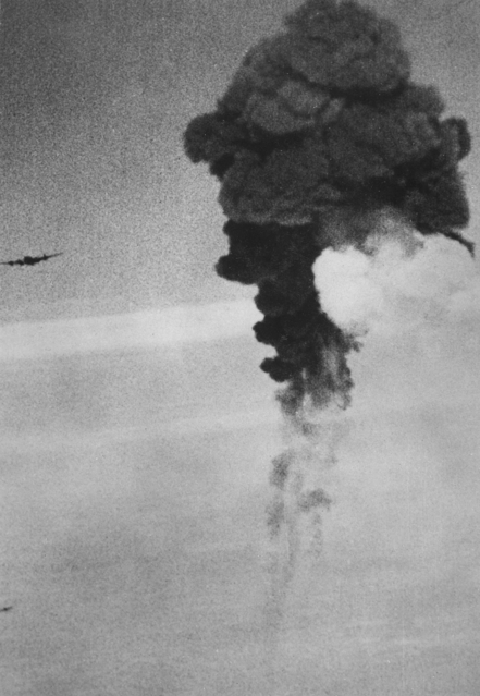 AWM caption : EUROPE, C.1945. A DIRECT HIT BY FLAK ON A RAF LANCASTER BOMBER AIRCRAFT.